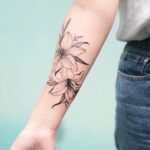 70 Meaningful Lily Tattoo Designs for Women Ideas 18